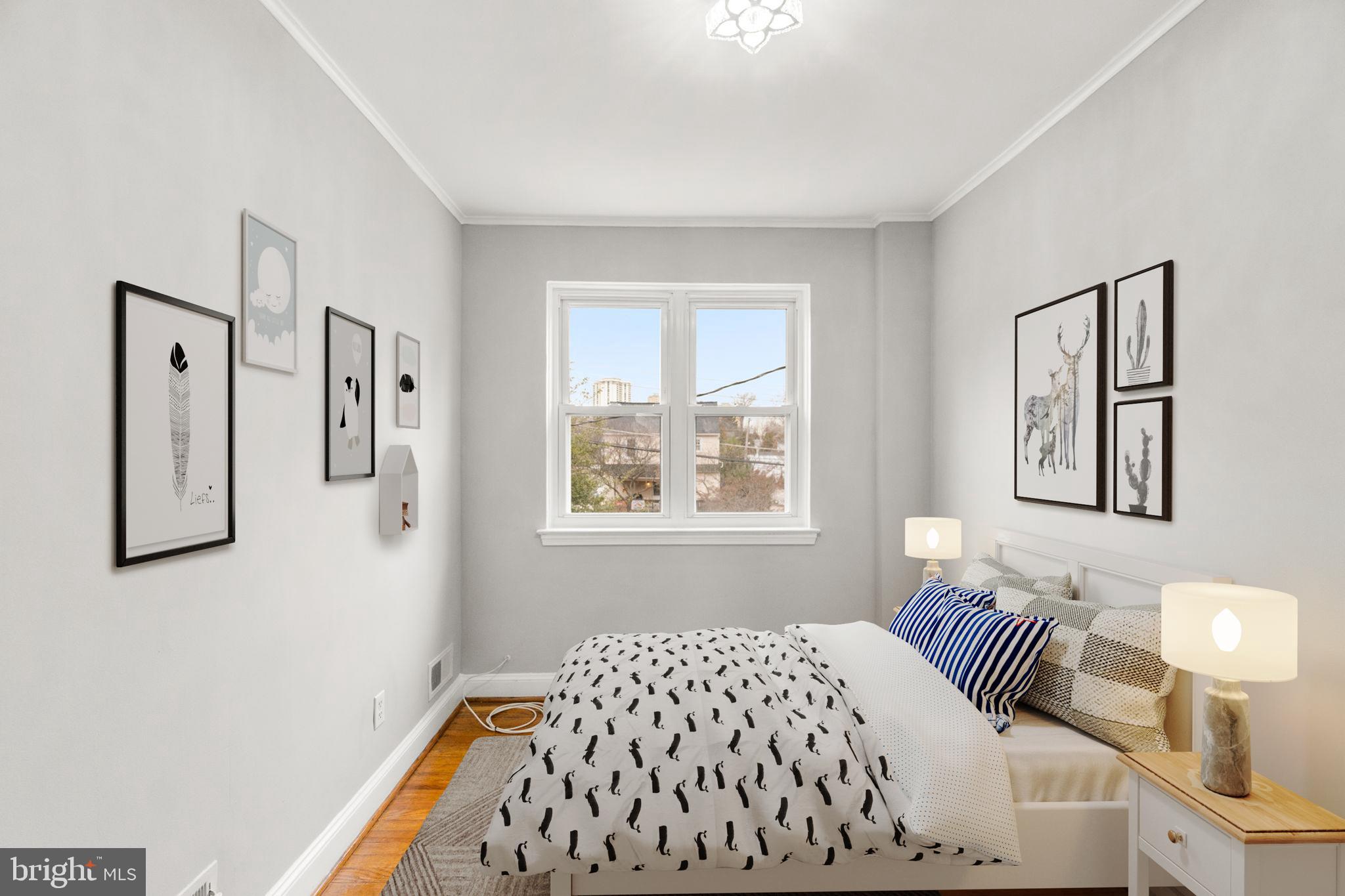 134 Marburth Avenue Baltimore, MD 21286 - Photo 13 of 27 a bedroom with a bed and painting on the wall