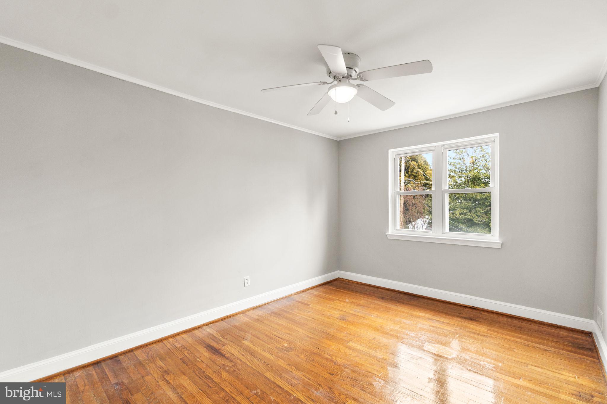 134 Marburth Avenue Baltimore, MD 21286 - Photo 16 of 27 a view of a big room with wooden floor and windows in a room