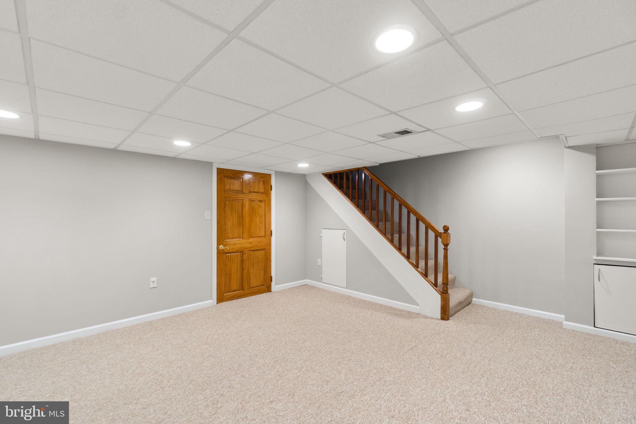 134 Marburth Avenue Baltimore, MD 21286 - Photo 19 of 27 a view of an empty room with wooden floor