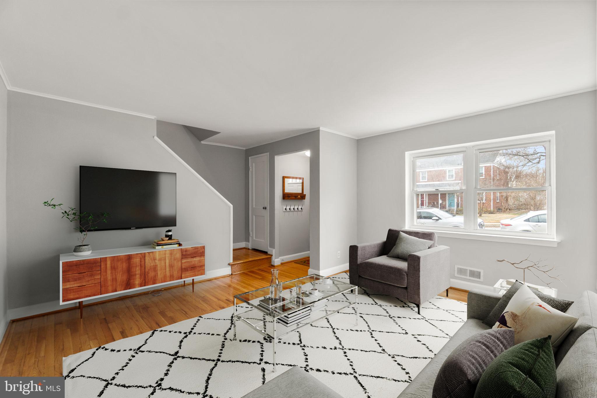 134 Marburth Avenue Baltimore, MD 21286 - Photo 2 of 27 a living room with furniture and a flat screen tv