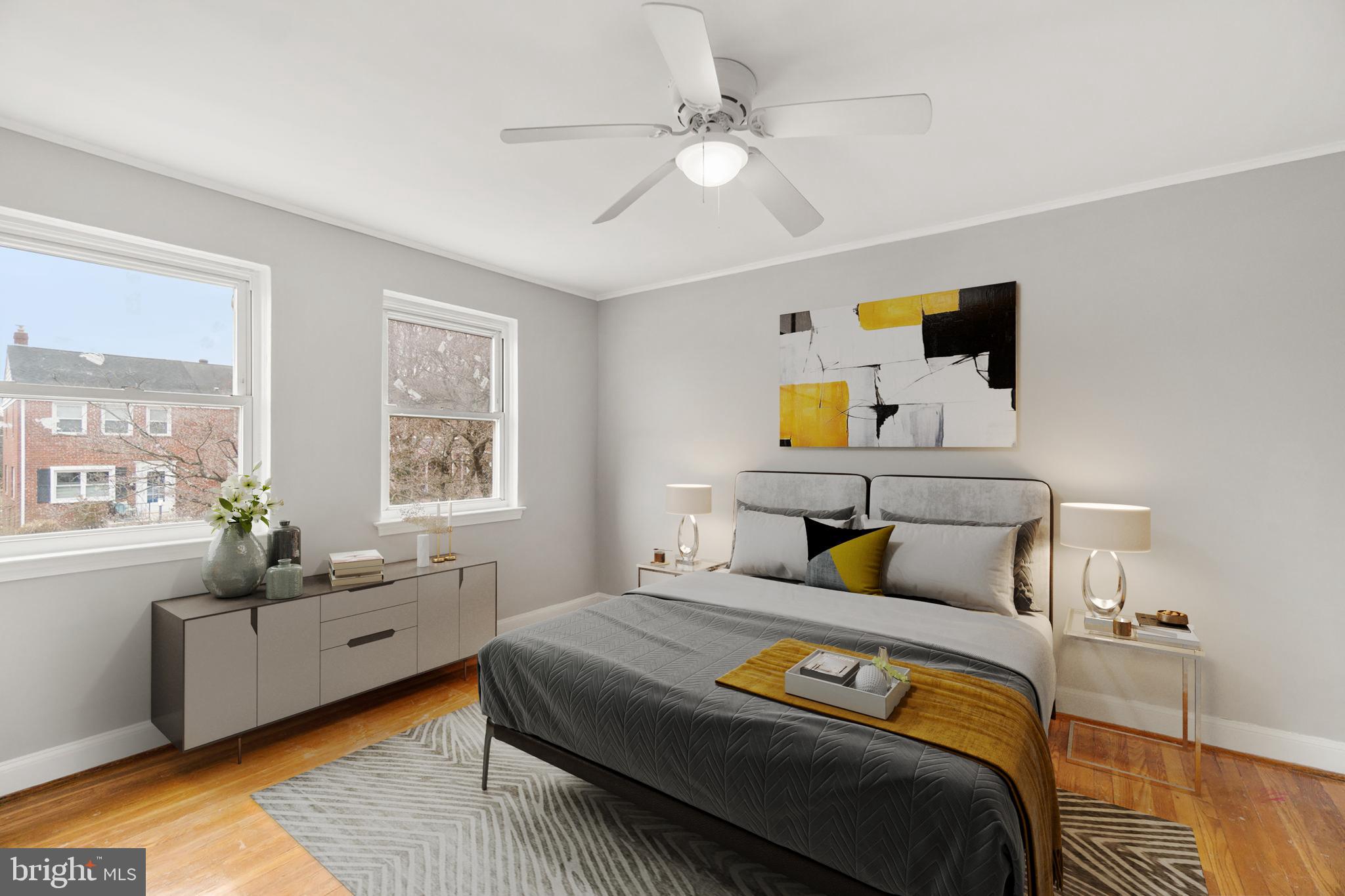 134 Marburth Avenue Baltimore, MD 21286 - Photo 10 of 27 a bedroom with a bed and wooden floor