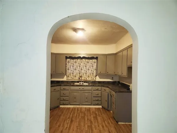 a kitchen with a sink and cabinets
