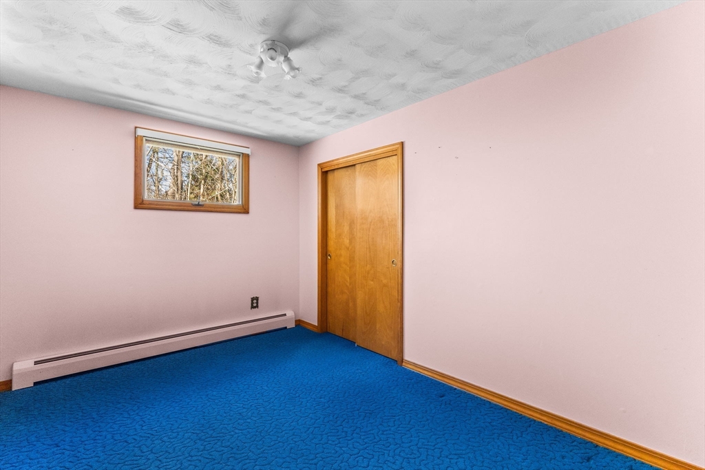 45 King Street Raynham, MA 02767 - Photo 17 of 29 an empty room with wooden floor and windows