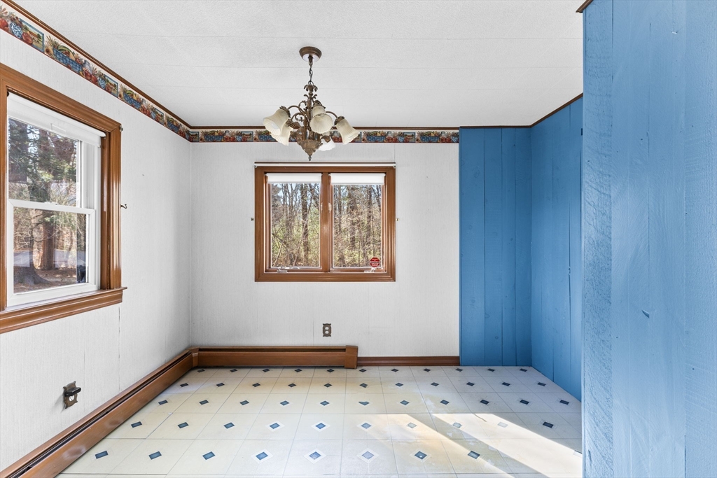 45 King Street Raynham, MA 02767 - Photo 10 of 29 a bedroom with a bed and a window