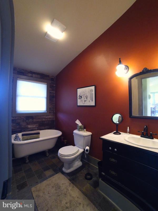 31 Starks Road Washington, VA 22747 - Photo 15 of 30 a bathroom with a toilet sink and mirror