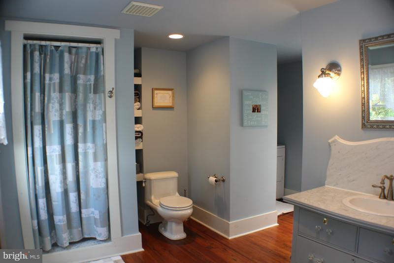 31 Starks Road Washington, VA 22747 - Photo 22 of 30 a bathroom with a toilet a sink and shower