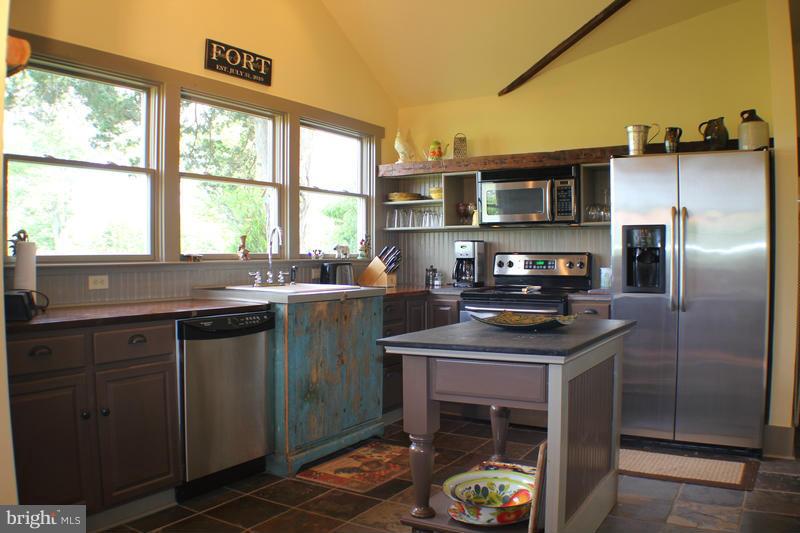 31 Starks Road Washington, VA 22747 - Photo 10 of 30 a kitchen with stainless steel appliances granite countertop a sink stove and refrigerator