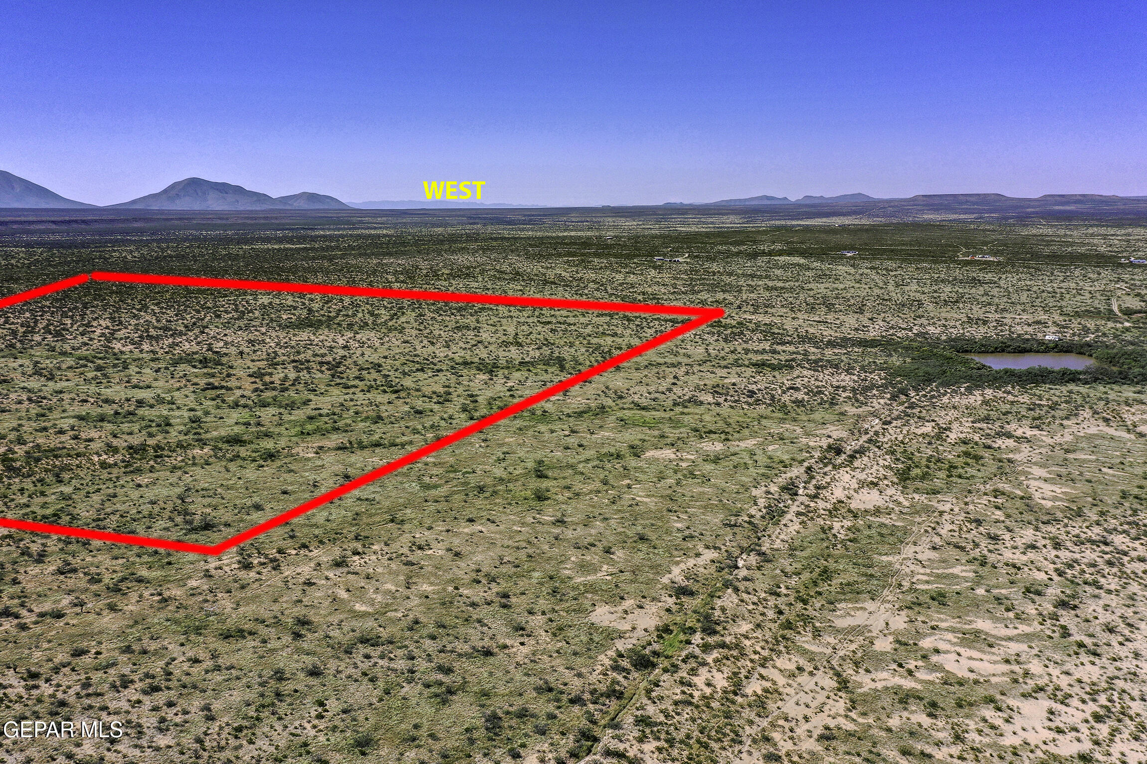 76041-4 Pn Ranch, Unit 617 Sierra Blanca, TX 79851 - Photo 7 of 28 a view of a road with a lake and mountain view