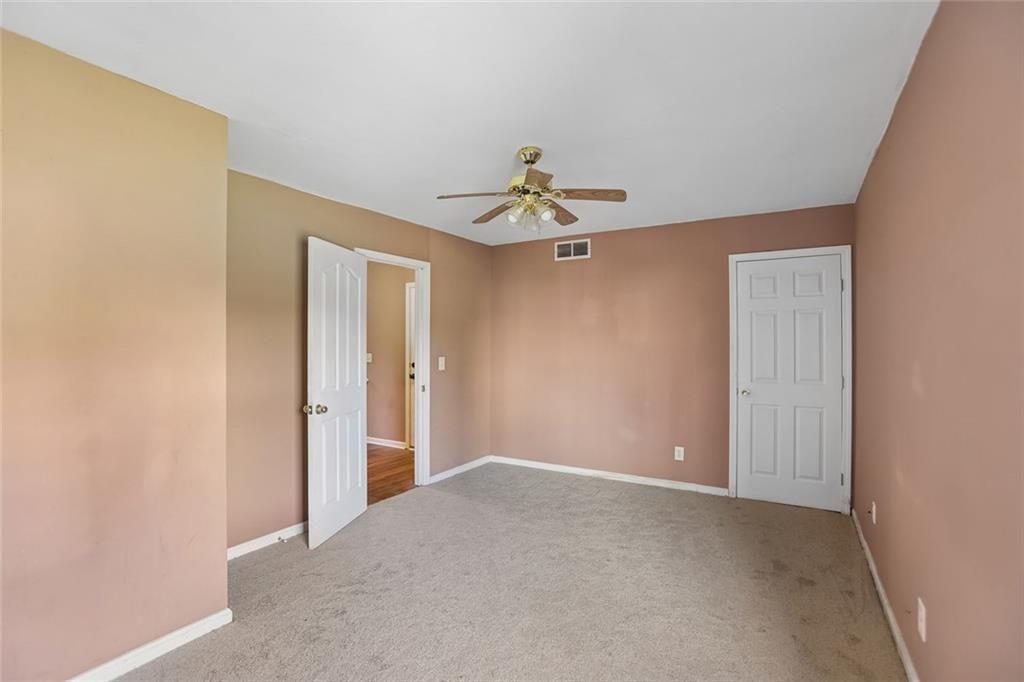 9720 Poole Road Villa Rica, GA 30180 - Photo 27 of 40 a view of an empty room with a ceiling fan