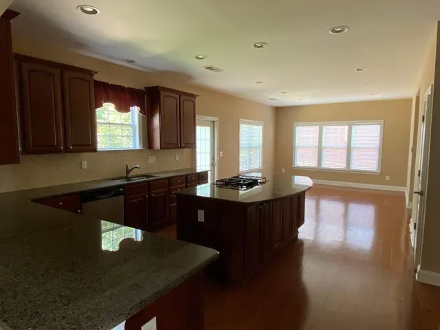 a kitchen with a sink appliances and a counter top space