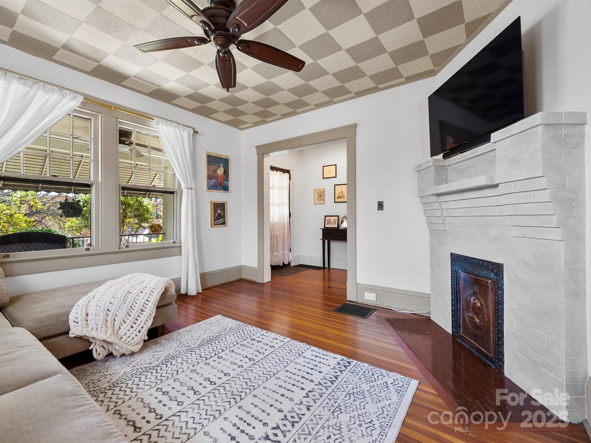 127 Pennsylvania Avenue Asheville, NC 28806 - Photo 11 of 48 a living room with furniture and a fireplace