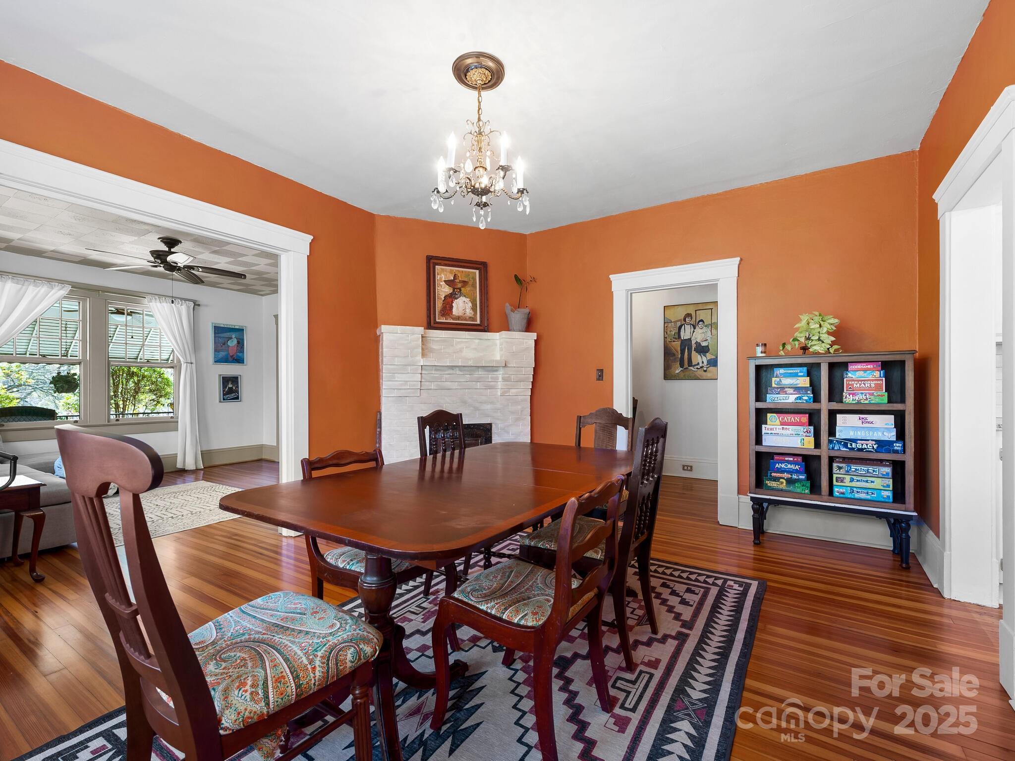127 Pennsylvania Avenue Asheville, NC 28806 - Photo 15 of 48 a view of a dining room with furniture window and wooden floor