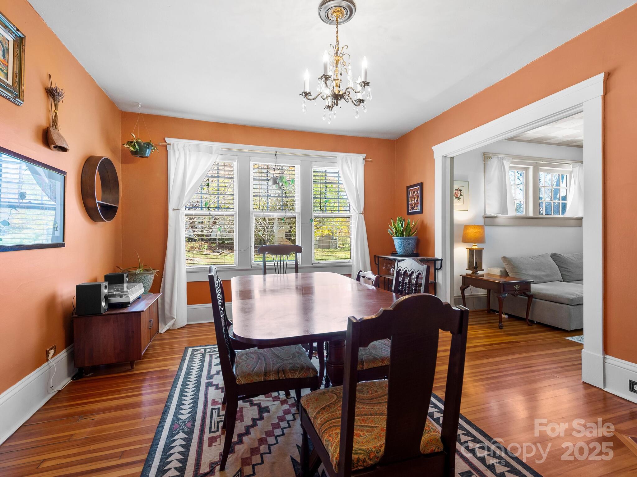 127 Pennsylvania Avenue Asheville, NC 28806 - Photo 17 of 48 a view of a dining room with furniture window and wooden floor