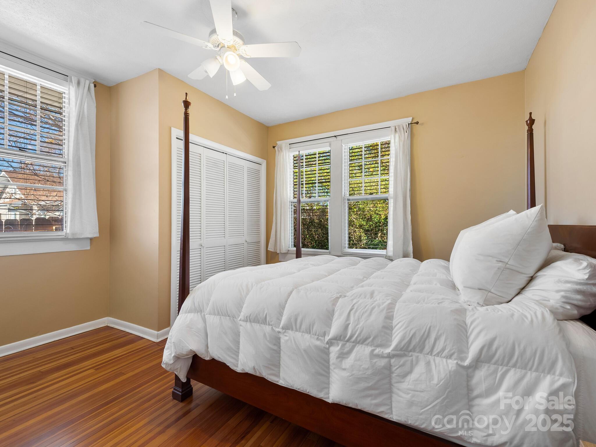 127 Pennsylvania Avenue Asheville, NC 28806 - Photo 24 of 48 a bedroom with a bed and a window