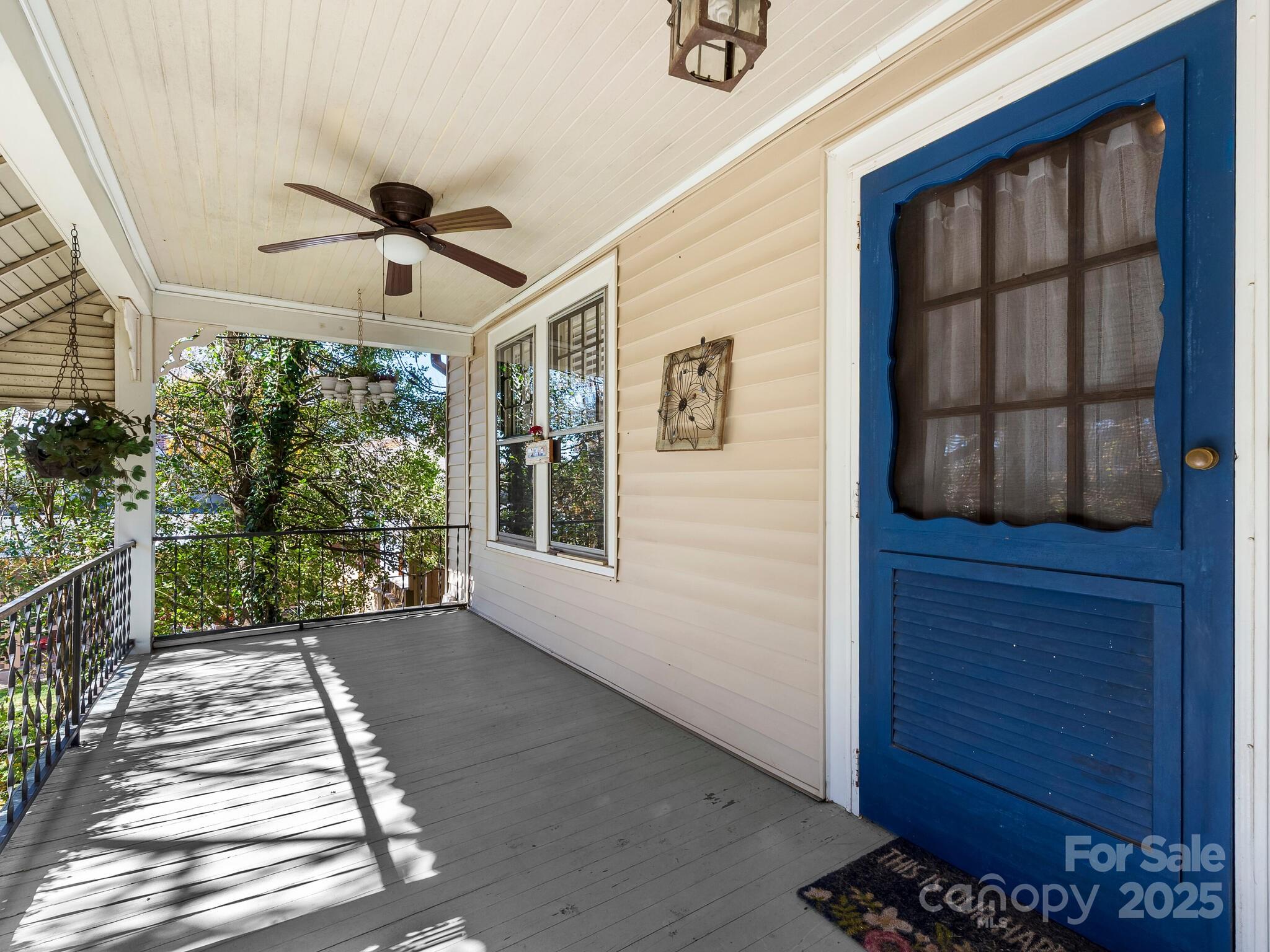 127 Pennsylvania Avenue Asheville, NC 28806 - Photo 3 of 48 a view of a porch with wooden floor and front door