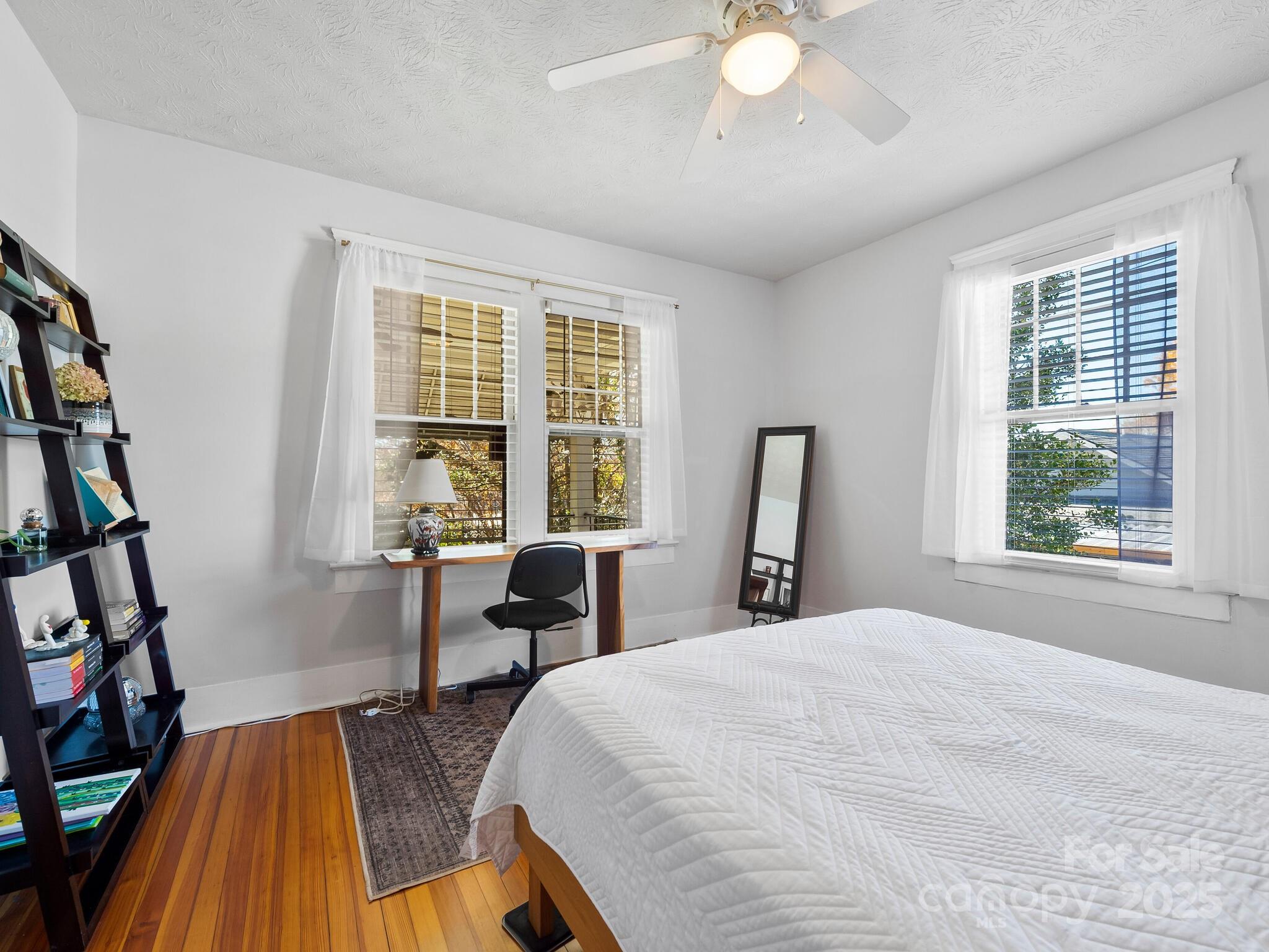 127 Pennsylvania Avenue Asheville, NC 28806 - Photo 33 of 48 a bedroom with a bed and a large window