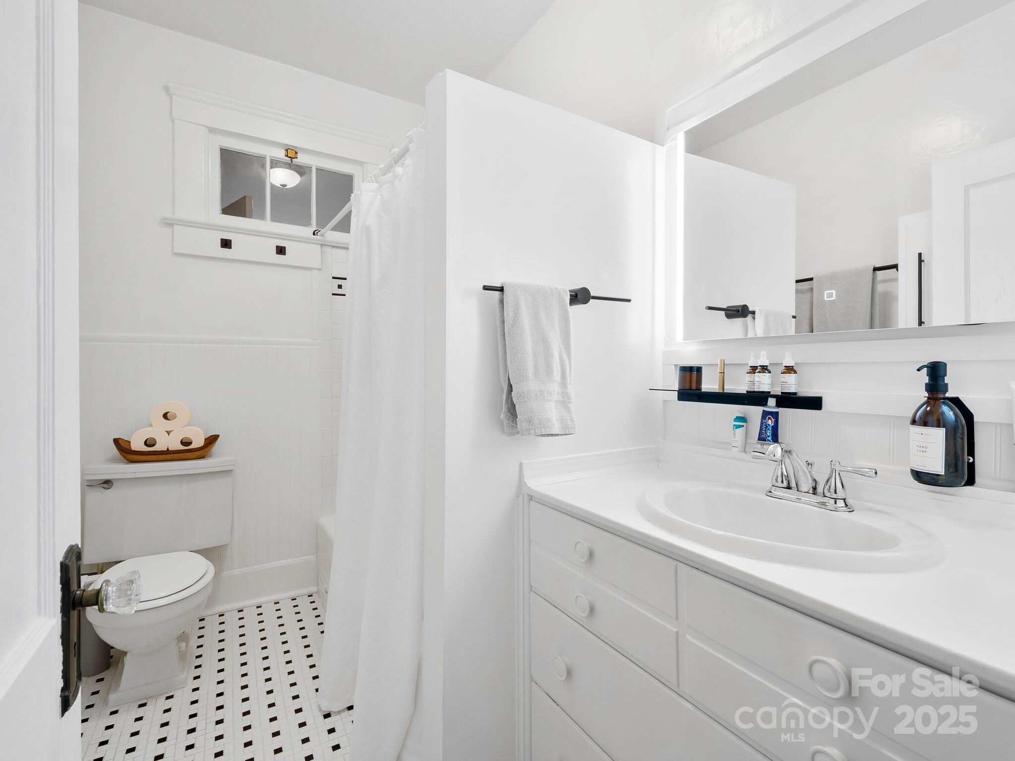 127 Pennsylvania Avenue Asheville, NC 28806 - Photo 36 of 48 a bathroom with a sink toilet and shower