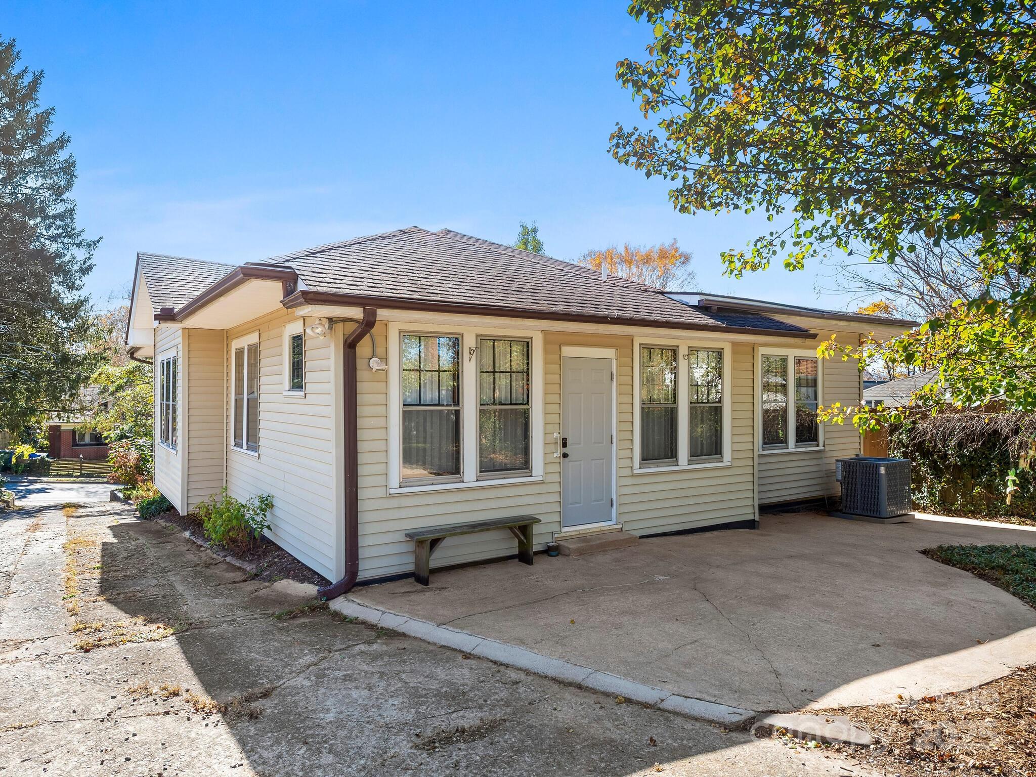 127 Pennsylvania Avenue Asheville, NC 28806 - Photo 40 of 48 a view of a house with a garden