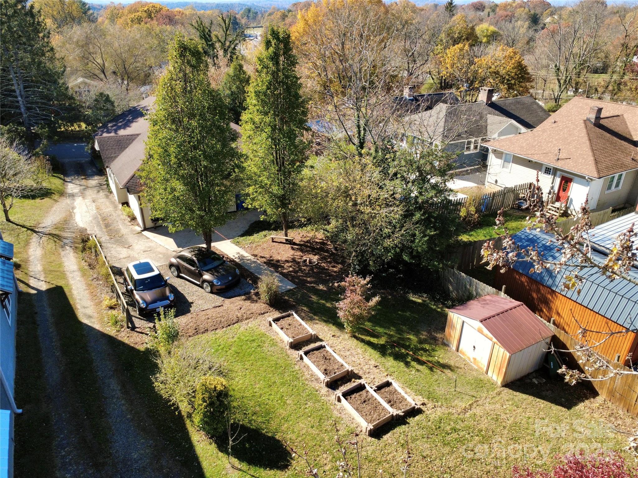 127 Pennsylvania Avenue Asheville, NC 28806 - Photo 42 of 48 an aerial view of a house with a yard and lake view