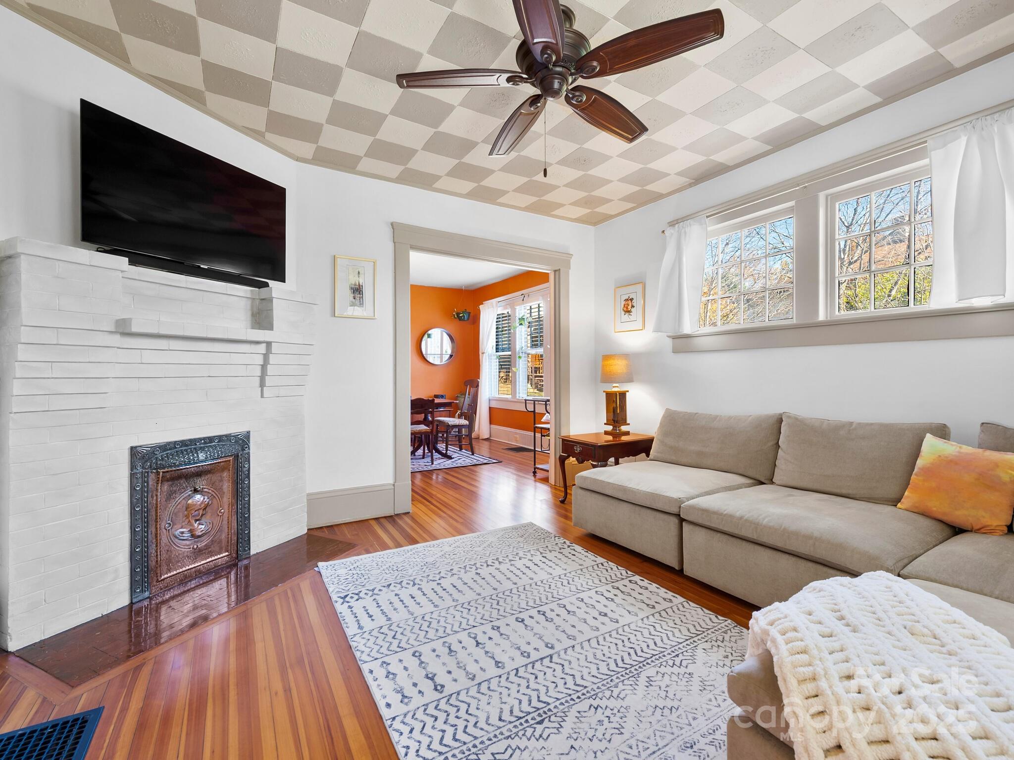 127 Pennsylvania Avenue Asheville, NC 28806 - Photo 8 of 48 a living room with furniture and a flat screen tv