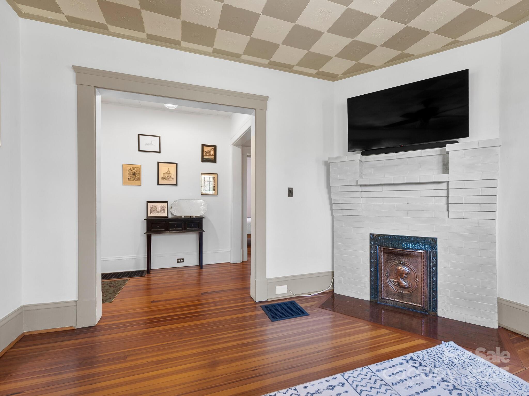 127 Pennsylvania Avenue Asheville, NC 28806 - Photo 9 of 48 a view of living room with flat screen tv and kitchen view