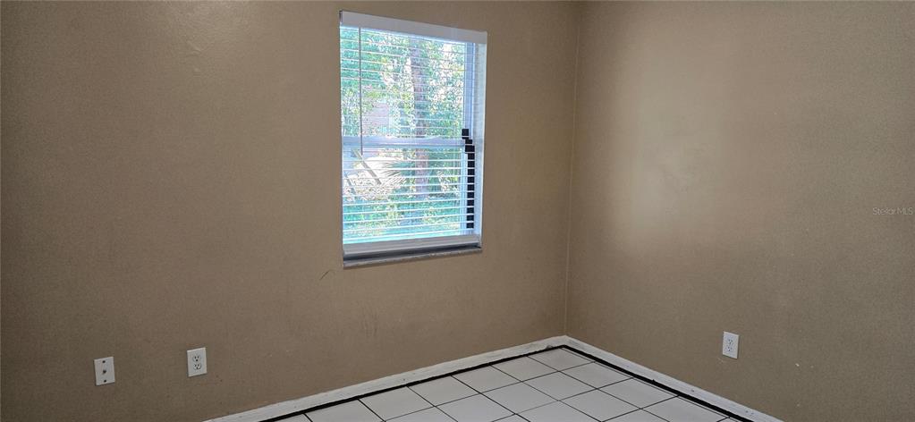 2530 Georgia Avenue, Unit B Sanford, FL 32773 - Photo 26 of 48 an empty room with a window