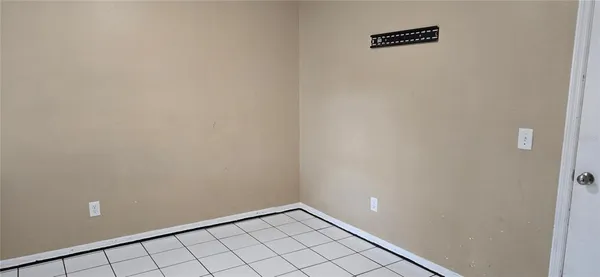 a bathroom with a shower and a glass door