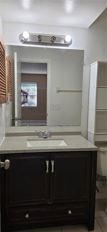 2530 Georgia Avenue, Unit B Sanford, FL 32773 - Photo 40 of 48 a bathroom with a sink and a mirror