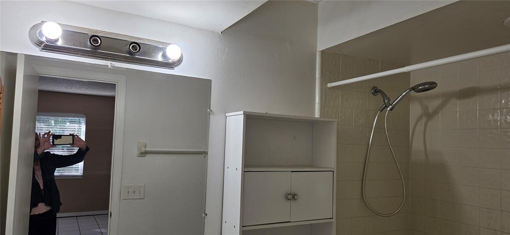 2530 Georgia Avenue, Unit B Sanford, FL 32773 - Photo 41 of 48 a bathroom with a shower