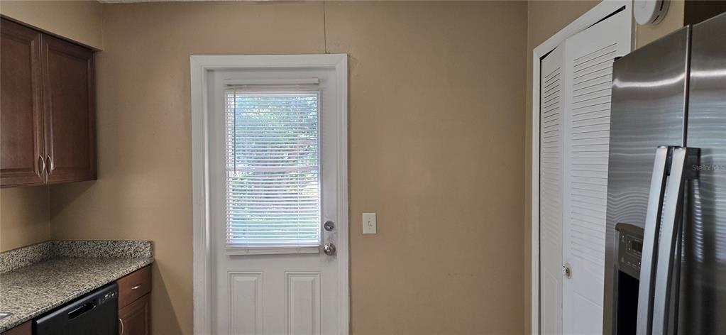 2530 Georgia Avenue, Unit B Sanford, FL 32773 - Photo 5 of 48 a kitchen with a refrigerator and cabinets