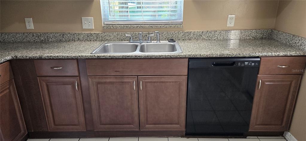 2530 Georgia Avenue, Unit B Sanford, FL 32773 - Photo 7 of 48 a kitchen with granite countertop a sink and a granite counter tops