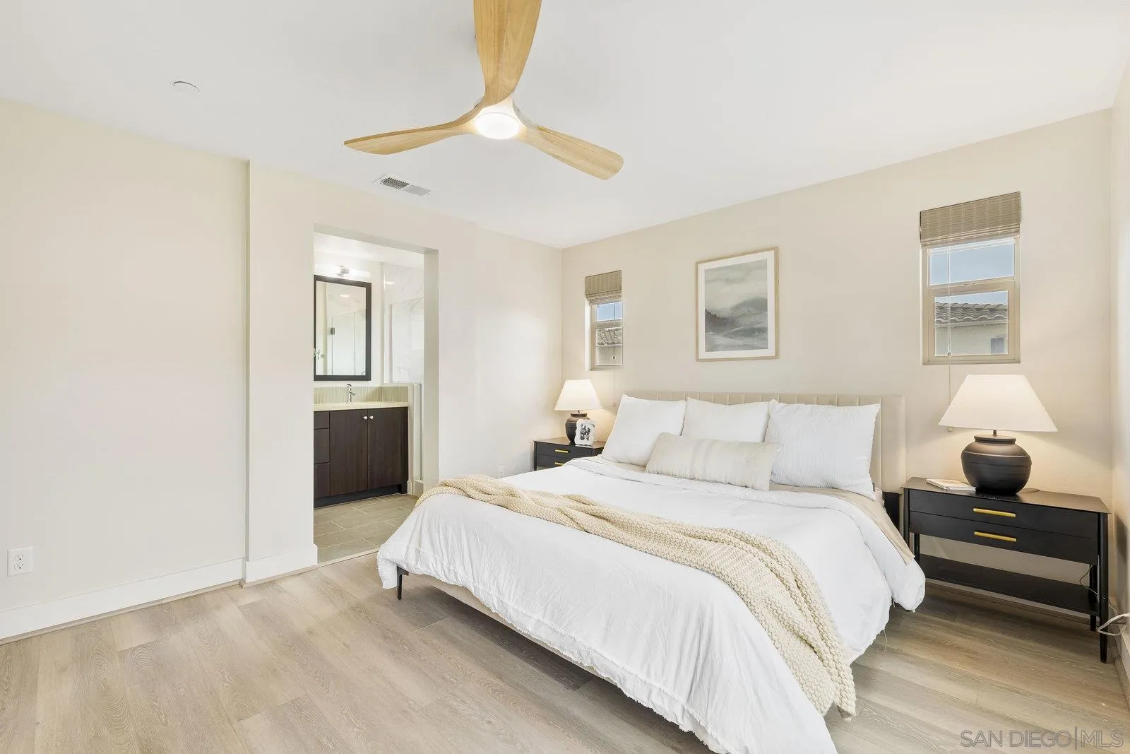 1676 Shorebreak Way Encinitas, CA 92024 - Photo 16 of 61 a bedroom with a bed and a chandelier