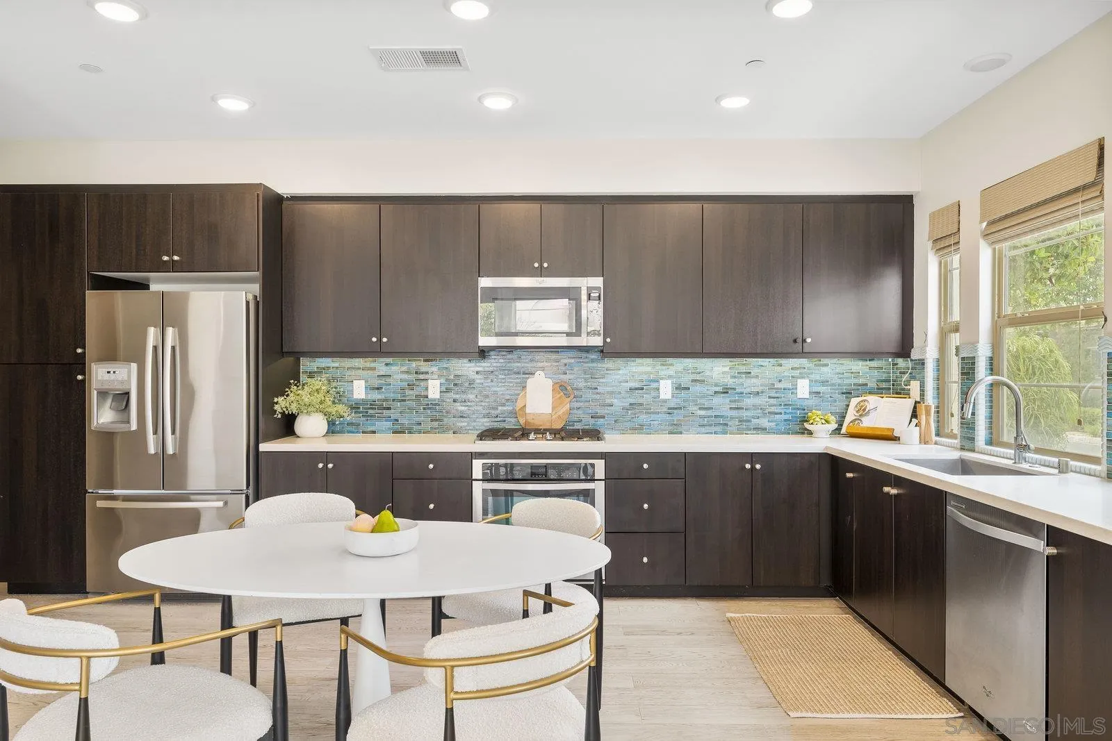 1676 Shorebreak Way Encinitas, CA 92024 - Photo 25 of 61 a kitchen with stainless steel appliances granite countertop a stove a sink a refrigerator and a refrigerator