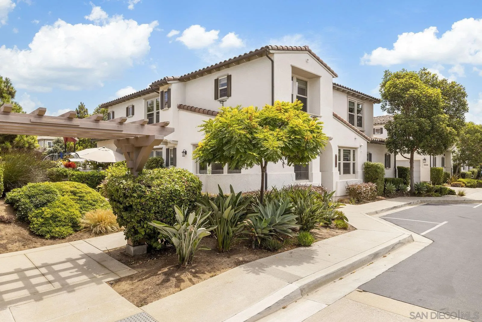 1676 Shorebreak Way Encinitas, CA 92024 - Photo 3 of 61 a front view of a house with garden