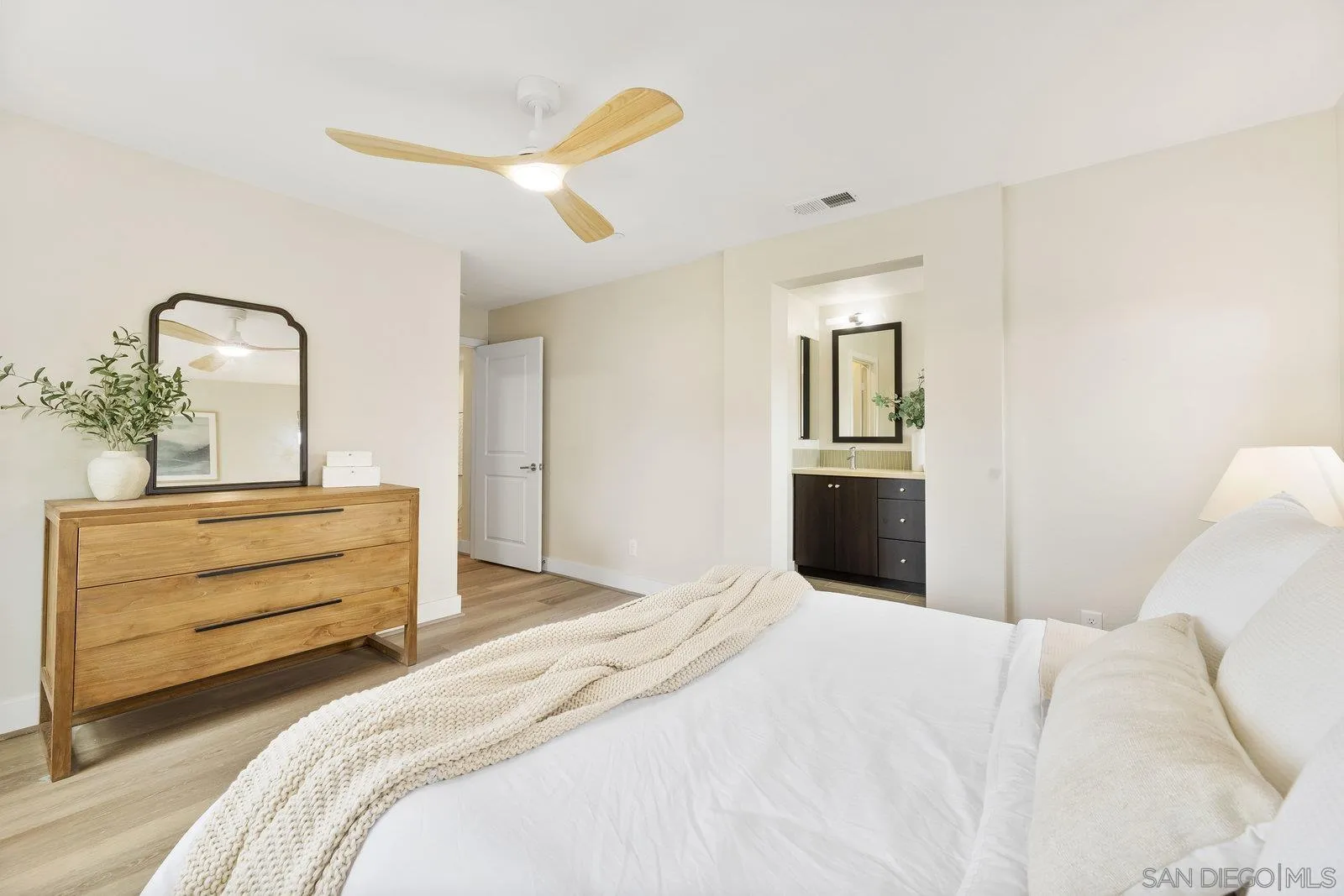 1676 Shorebreak Way Encinitas, CA 92024 - Photo 34 of 61 a bedroom with a bed and a dresser