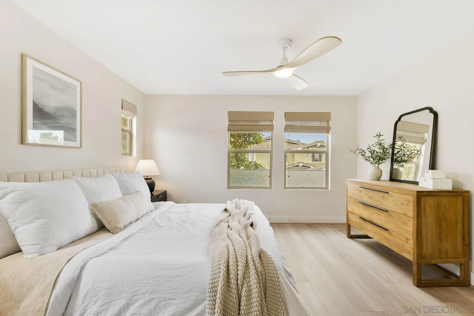 1676 Shorebreak Way Encinitas, CA 92024 - Photo 40 of 61 a bedroom with a bed and a dresser next to a window