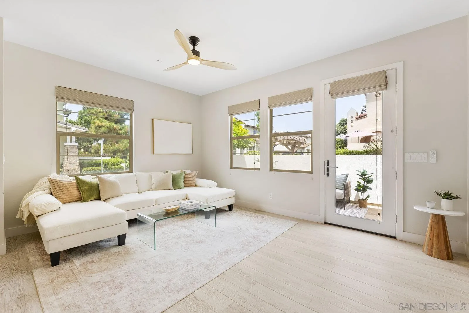 1676 Shorebreak Way Encinitas, CA 92024 - Photo 8 of 61 a living room with furniture and windows
