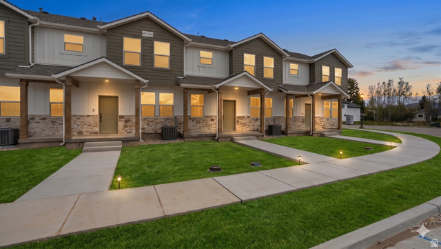 194 North 300th East, Unit 2 Morgan, UT 84050 - Photo 1 of 32 This is not the exact unit. All units have the same style and finishes throughout. Photo has been AI generated to add grass