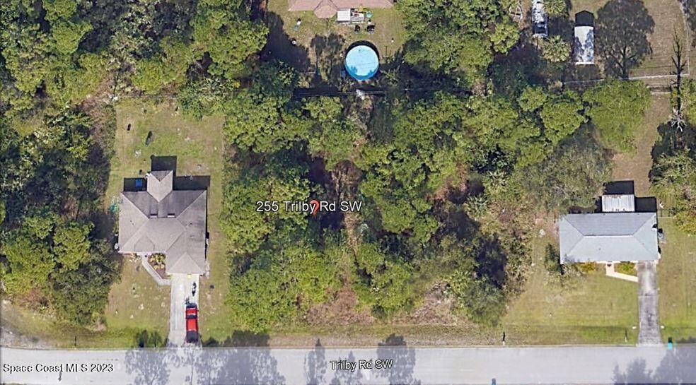 255 Trilby Road Southwest Palm Bay, FL 32908 - Photo 4 of 33 an aerial view of a house with a yard