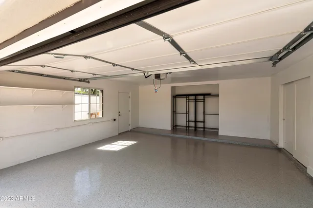 an aerial view of residential house with outdoor space and swimming pool