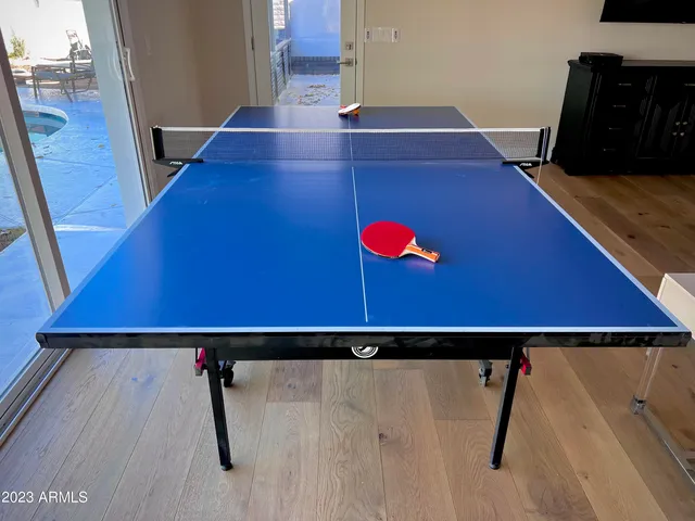 a bedroom with a bed and a ceiling fan
