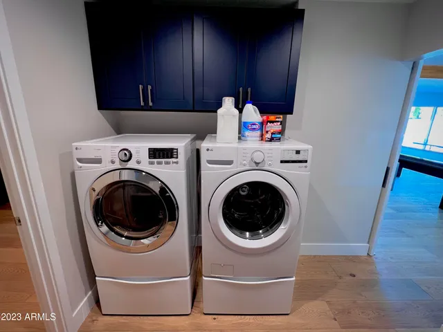 a bedroom with a bed window and a flat screen tv