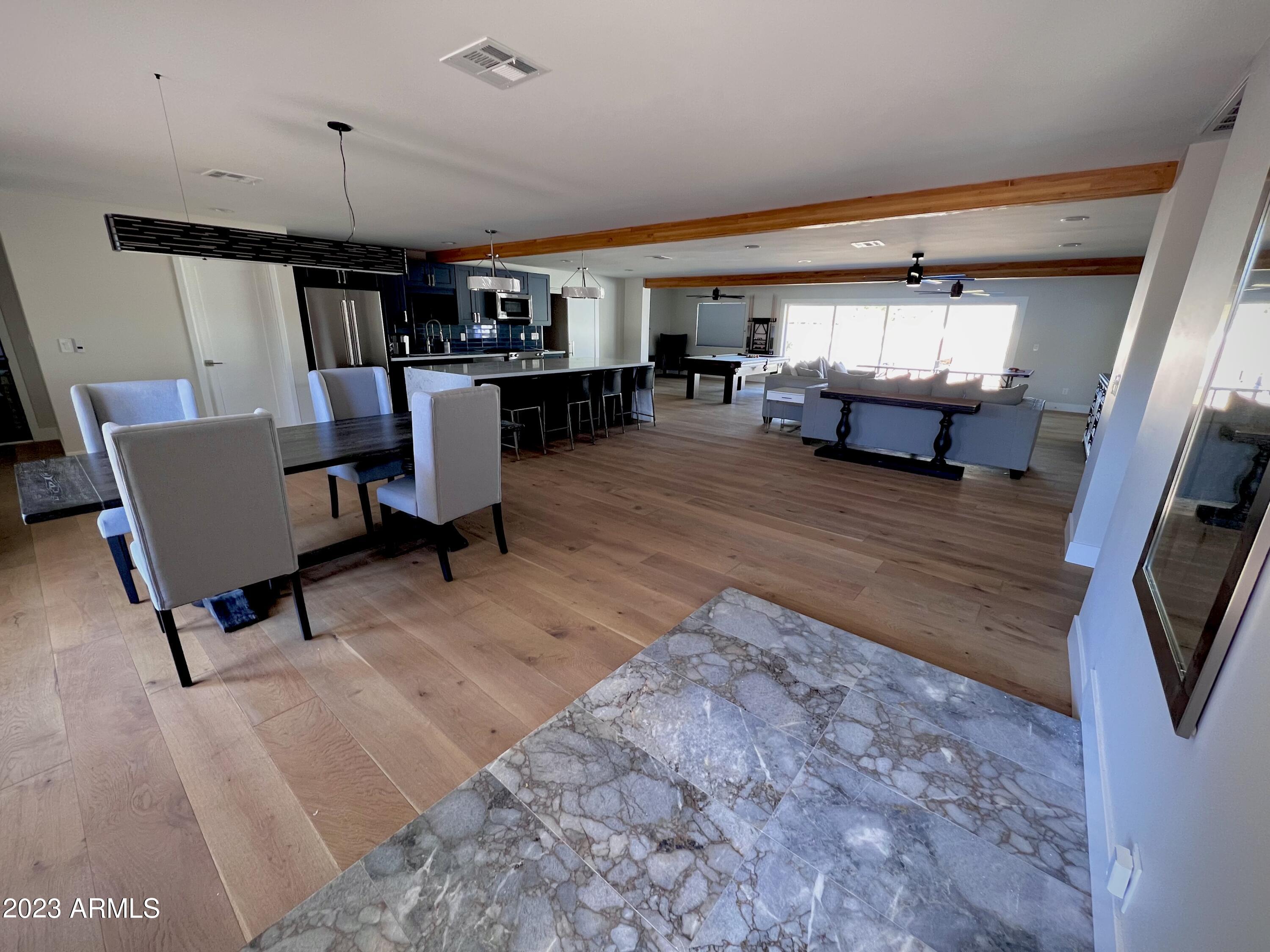 3318 East Onyx Avenue Phoenix, AZ 85028 - Photo 43 of 55 a living room with furniture and a flat screen tv