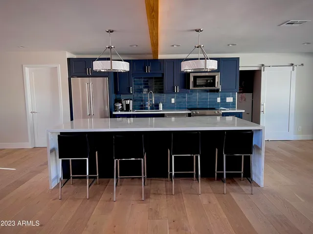 a view of a living room with furniture and a window