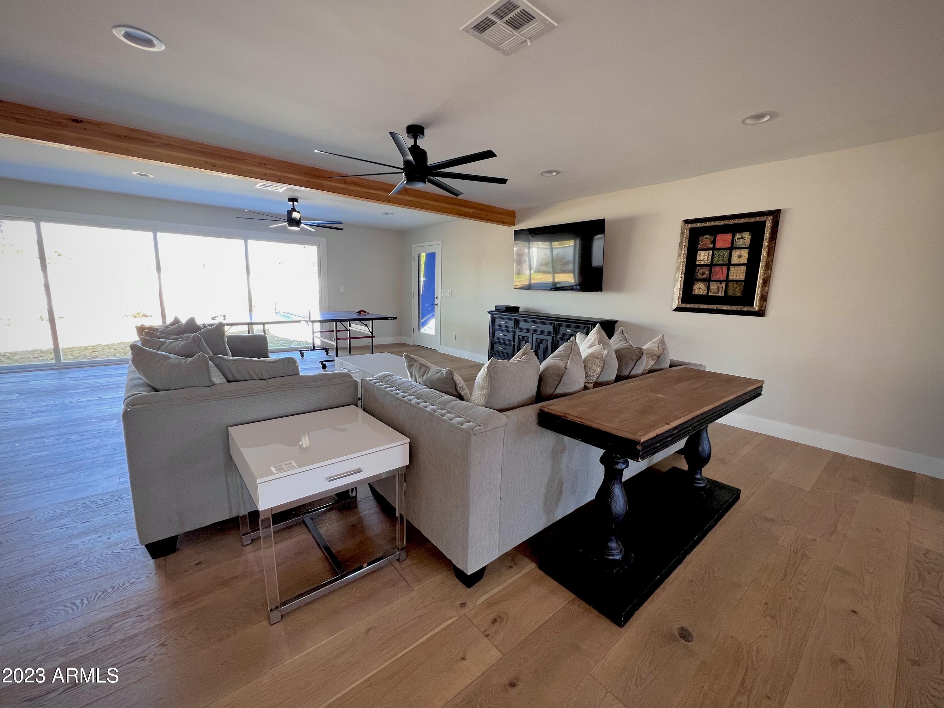 3318 East Onyx Avenue Phoenix, AZ 85028 - Photo 48 of 55 a living room with furniture and a window