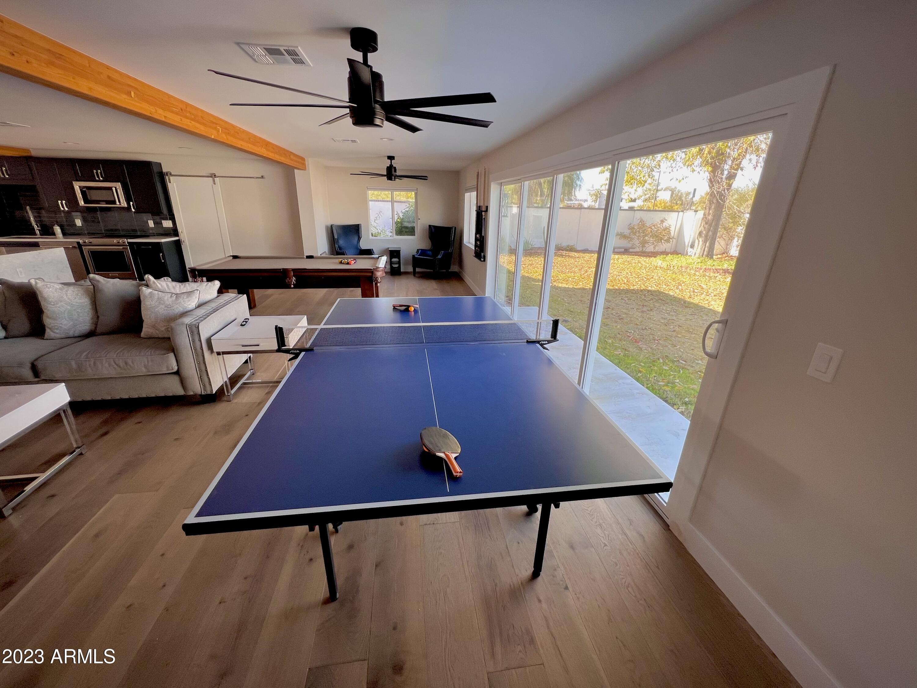 3318 East Onyx Avenue Phoenix, AZ 85028 - Photo 50 of 55 a view of a living room with furniture and a window