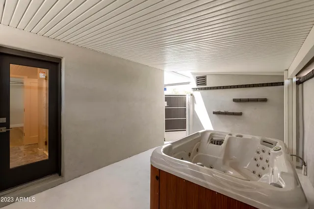 a large kitchen with stainless steel appliances kitchen island granite countertop a large counter top and wooden floors