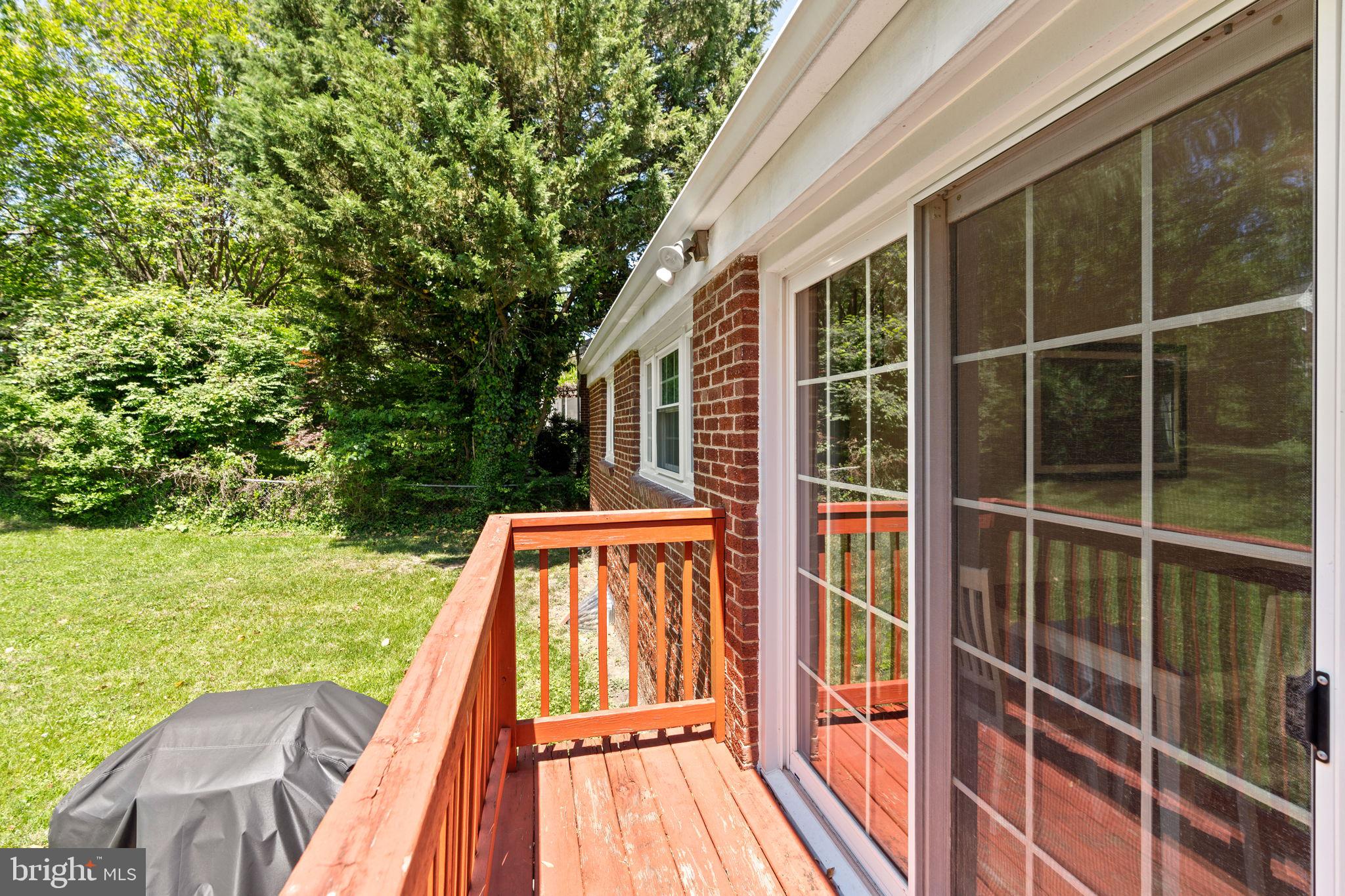 10310 Brunswick Avenue Silver Spring, MD 20902 - Photo 39 of 43 Serene deck overlooking lush greenery.