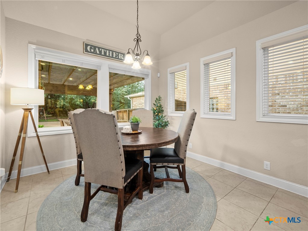28415 Willis Ranch San Antonio, TX 78260 - Photo 12 of 48 a view of a dining room with furniture window and outside view