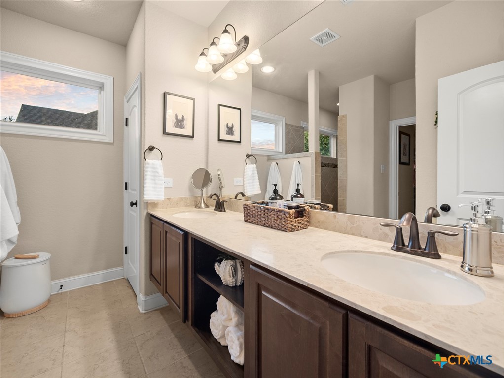 28415 Willis Ranch San Antonio, TX 78260 - Photo 18 of 48 a bathroom with a sink double vanity and a mirror